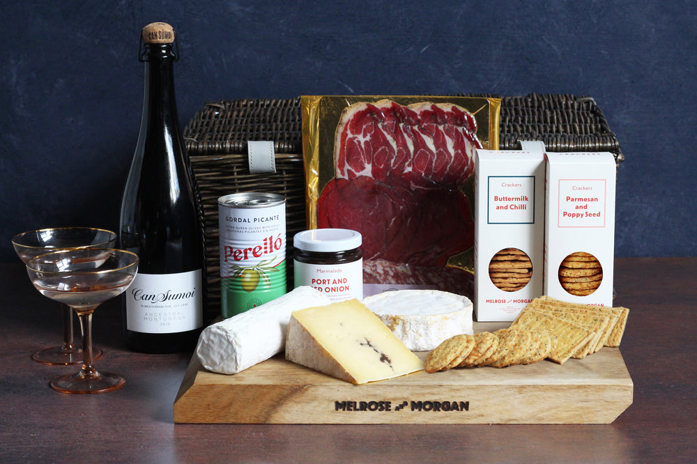 The Charcuterie and Cheese Gourmet Hamper will wow your guests with the finest selection of British and Continental cheeses, gourmet charcuterie, crackers,  condiments and our favourite sparkling wine. All packaged in a luxury cane hamper basket, this hamper makes a wonderful gift for family and friends who love fine food.
